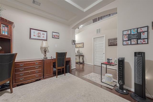 office area with dark hardwood / wood-style flooring, coffered ceiling, and beamed ceiling