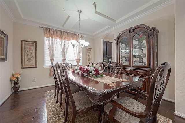 dining room with crown molding, coffered ceiling, dark wood-type flooring, and an inviting chandelier