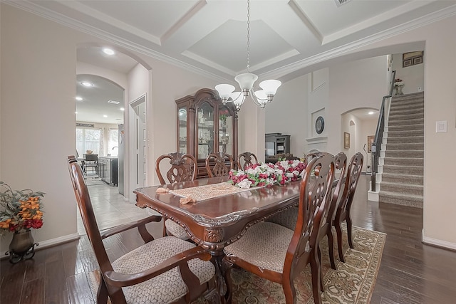 dining space with hardwood / wood-style flooring, coffered ceiling, and beam ceiling