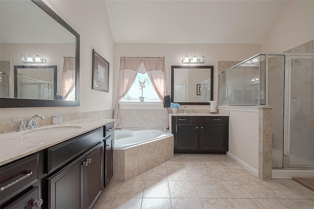 bathroom with lofted ceiling, vanity, tile patterned flooring, and shower with separate bathtub