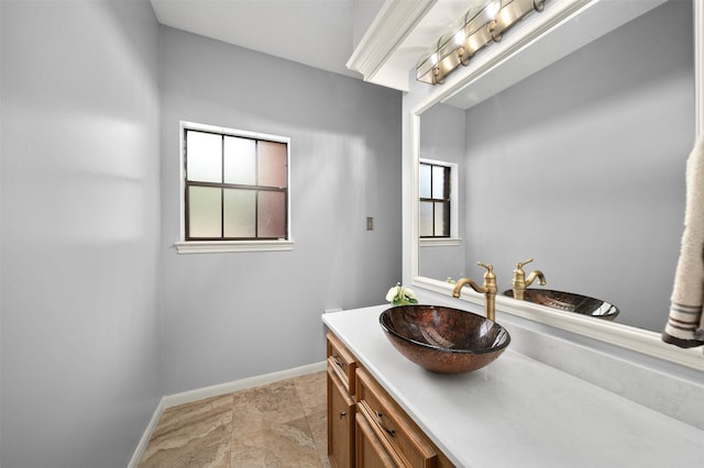 bathroom with a healthy amount of sunlight and vanity