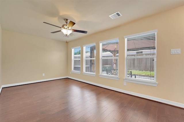 spare room with wood-type flooring and ceiling fan