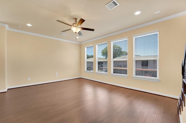 unfurnished room with dark wood-type flooring, ornamental molding, and ceiling fan