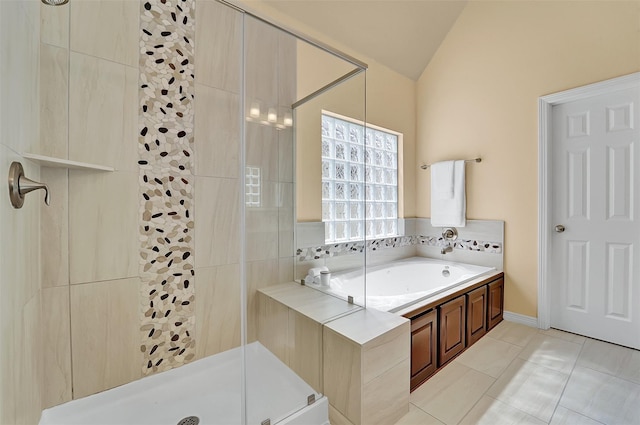 bathroom featuring lofted ceiling, tile patterned floors, and separate shower and tub