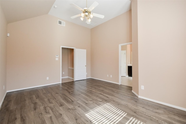 unfurnished room featuring wood-type flooring, high vaulted ceiling, and ceiling fan