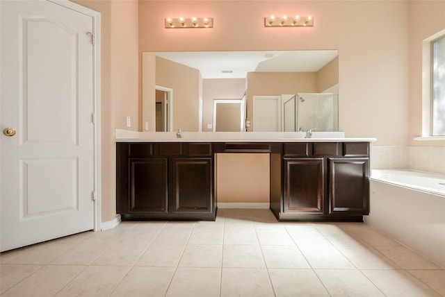 bathroom featuring vanity, tile patterned floors, and shower with separate bathtub