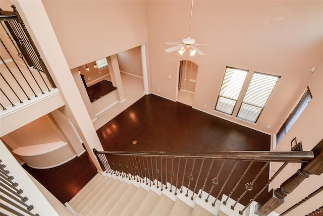 stairs featuring a high ceiling