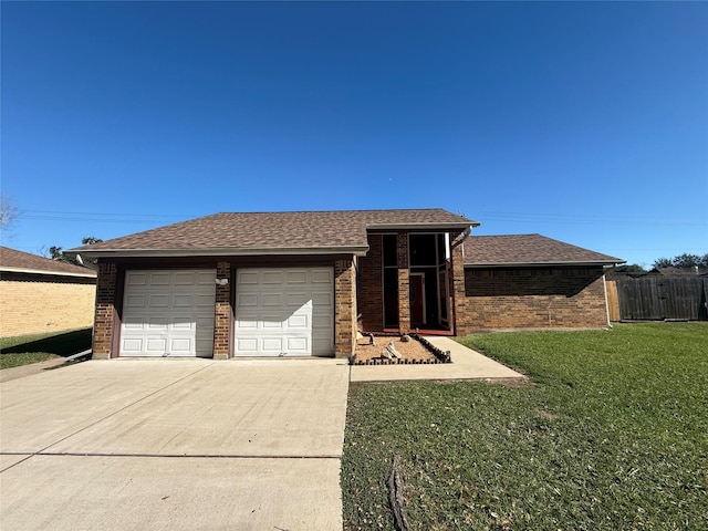 view of front facade with a garage and a front yard