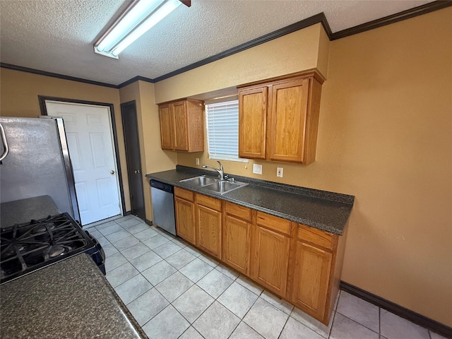 kitchen with sink, crown molding, a textured ceiling, and appliances with stainless steel finishes