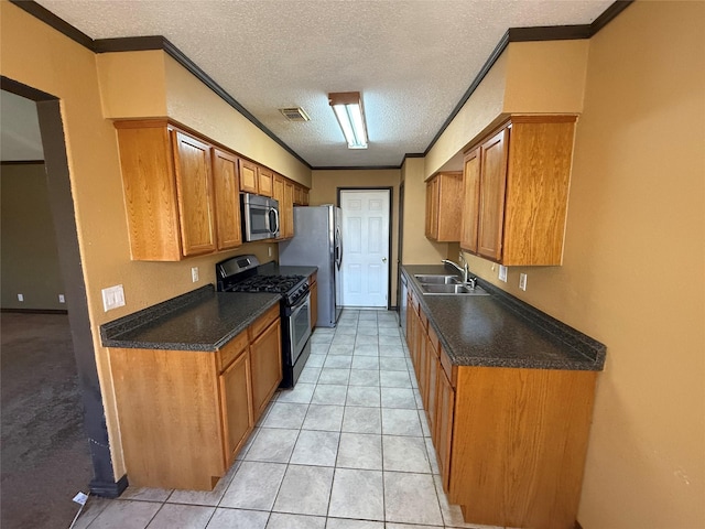 kitchen with stainless steel appliances, crown molding, sink, and a textured ceiling