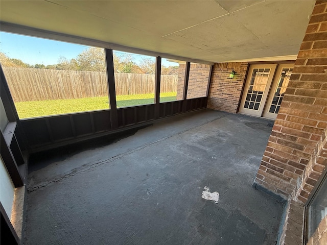 unfurnished sunroom with a wealth of natural light