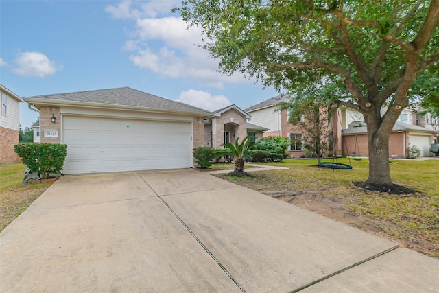 ranch-style home with a garage and a front yard