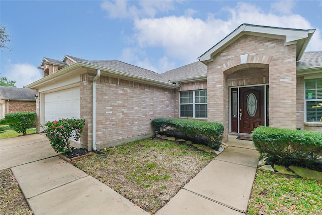 view of front of property with a garage