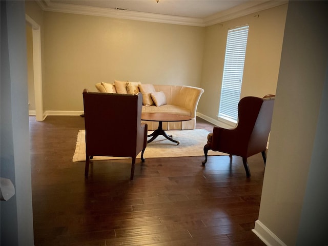 sitting room featuring ornamental molding and dark hardwood / wood-style floors