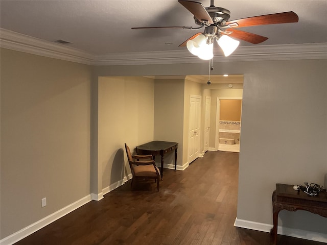 hallway with ornamental molding and dark hardwood / wood-style floors