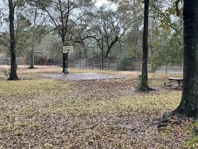 view of yard featuring basketball court