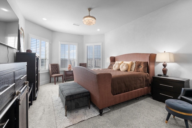 bedroom featuring light colored carpet