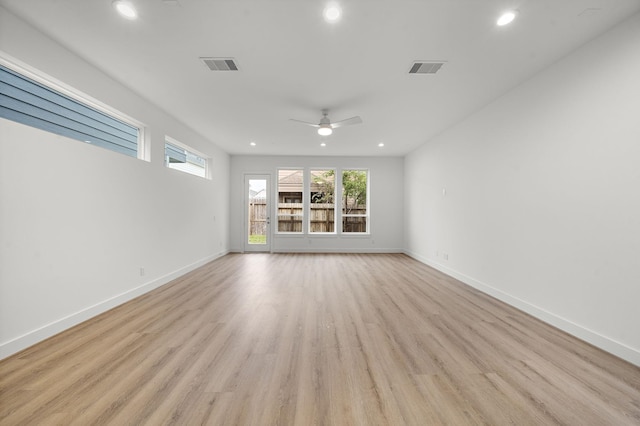 unfurnished living room with light hardwood / wood-style flooring and ceiling fan