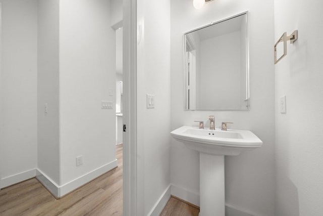 bathroom featuring sink and wood-type flooring