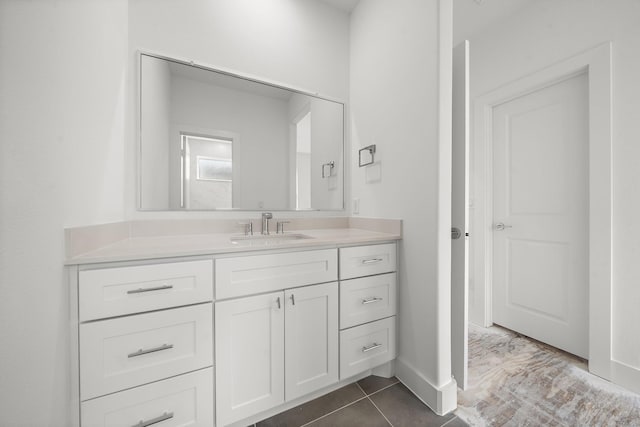 bathroom with vanity and tile patterned flooring