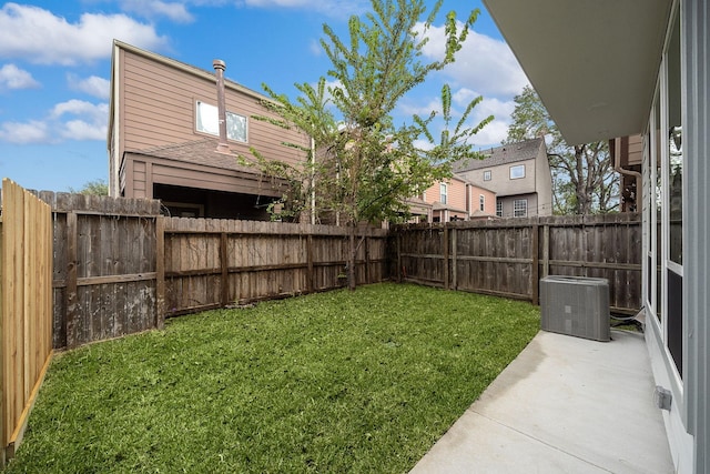 view of yard featuring central AC unit and a patio area