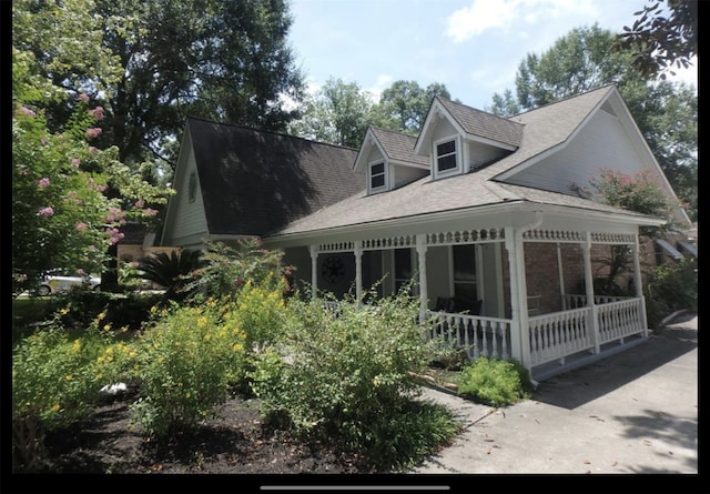 back of property with a sunroom