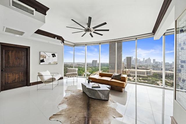 interior space with ceiling fan