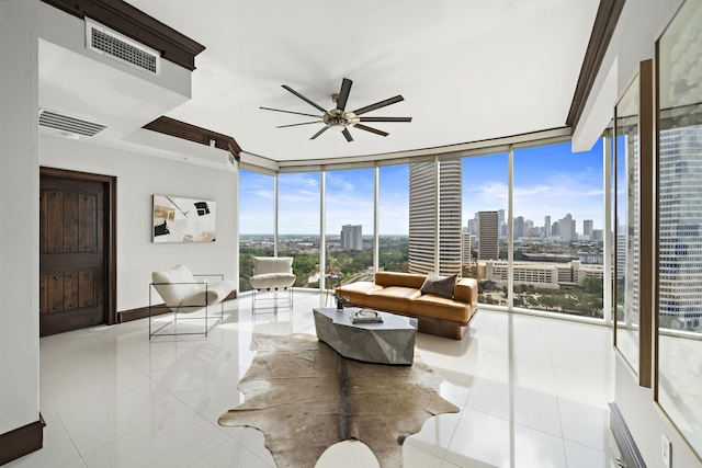 living room with ceiling fan and floor to ceiling windows