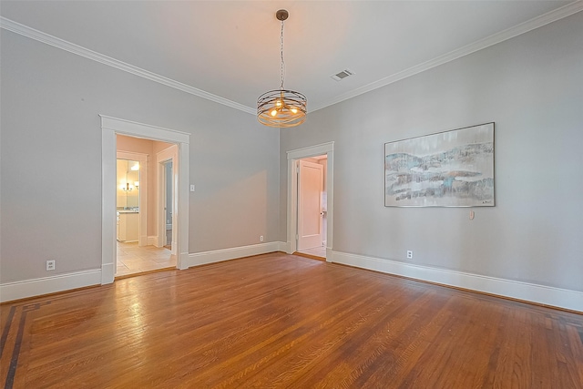 unfurnished room with ornamental molding and light hardwood / wood-style floors