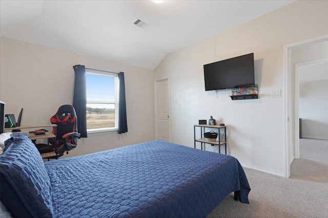 bedroom featuring lofted ceiling and carpet floors