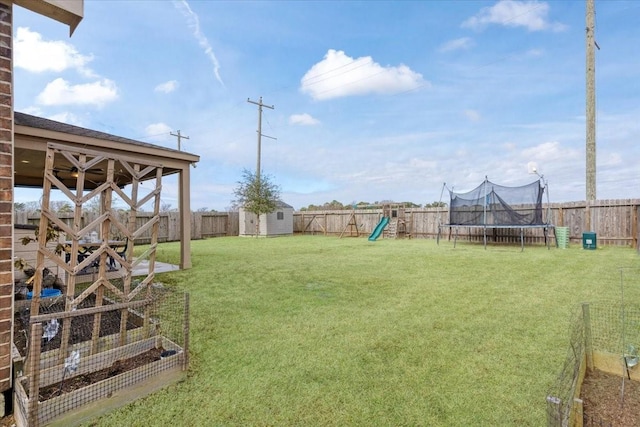 view of yard featuring a playground, a trampoline, and a storage shed