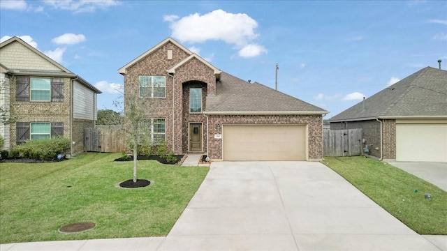 view of front facade with a garage and a front lawn