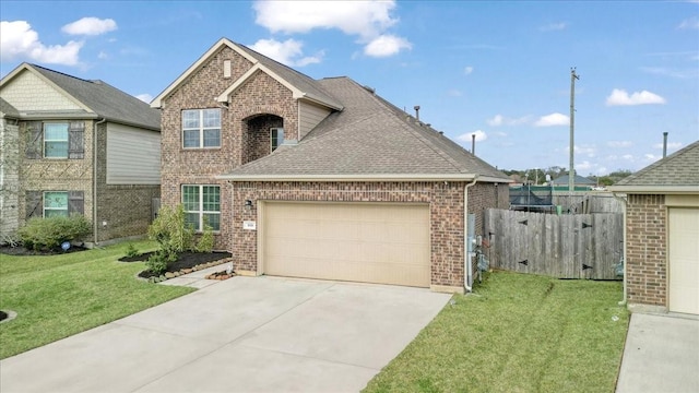 view of front facade featuring a garage and a front yard