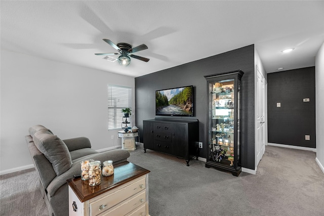 living room with light carpet and ceiling fan