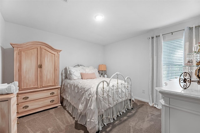 bedroom featuring dark colored carpet