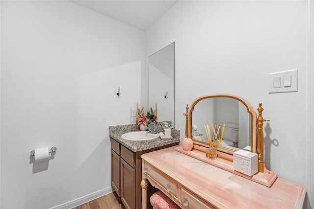 bathroom featuring hardwood / wood-style flooring and vanity