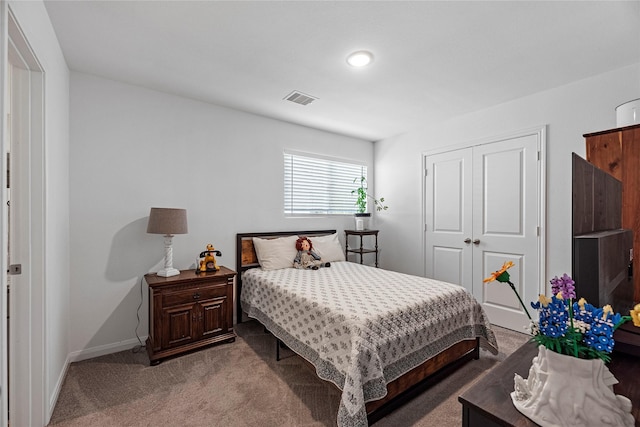 carpeted bedroom featuring a closet