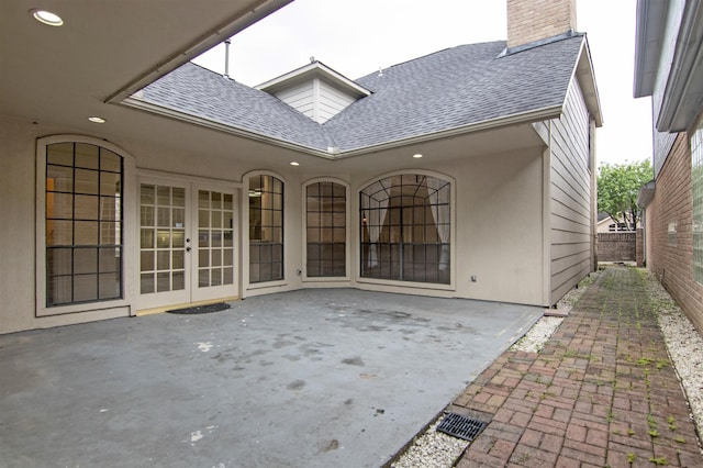 rear view of property with a patio and french doors