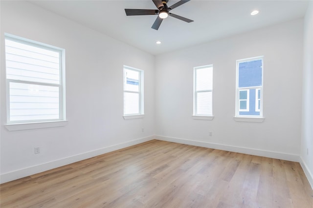 unfurnished room featuring ceiling fan and light hardwood / wood-style floors