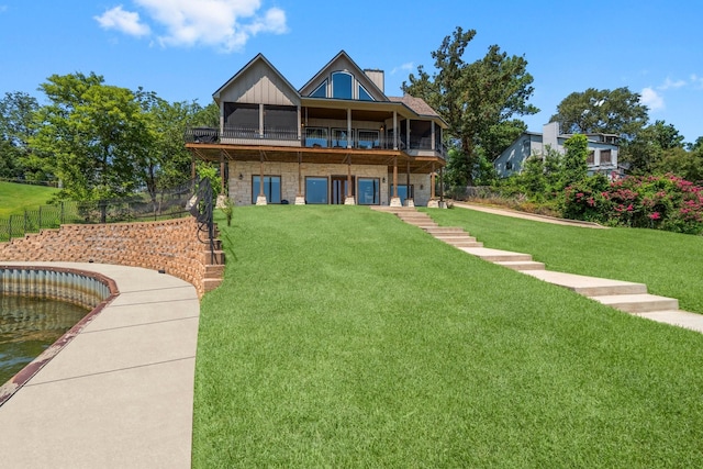 rear view of house with a lawn