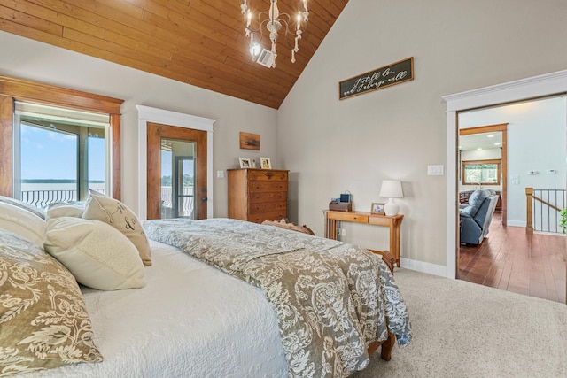 bedroom with wood ceiling, an inviting chandelier, high vaulted ceiling, and dark colored carpet