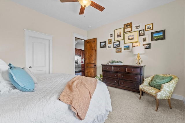 carpeted bedroom featuring stainless steel fridge and ceiling fan