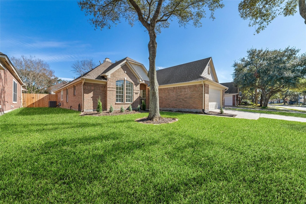 view of front facade featuring a garage and a front lawn