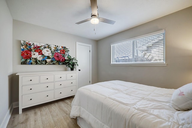 bedroom with ceiling fan and light hardwood / wood-style floors