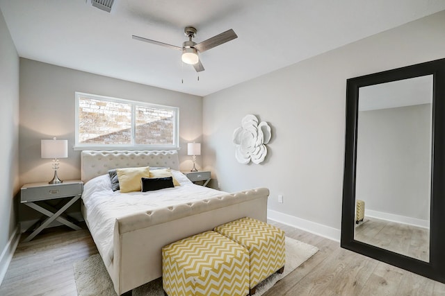 bedroom featuring ceiling fan and light hardwood / wood-style floors