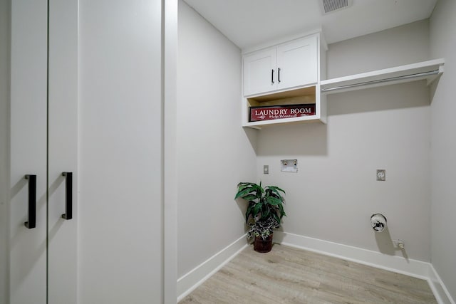 laundry area with cabinets, hookup for an electric dryer, washer hookup, and light wood-type flooring