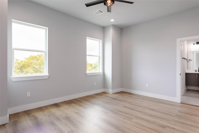 unfurnished room featuring ceiling fan and light hardwood / wood-style flooring