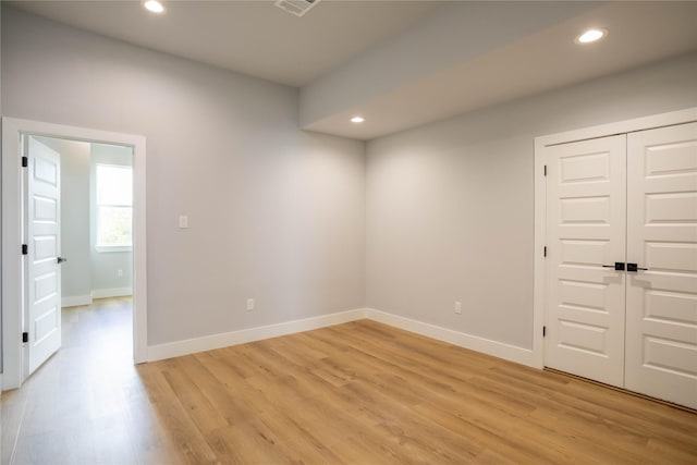 unfurnished room featuring light wood-type flooring