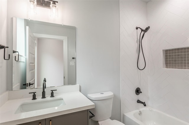 full bathroom featuring vanity, toilet, and tiled shower / bath