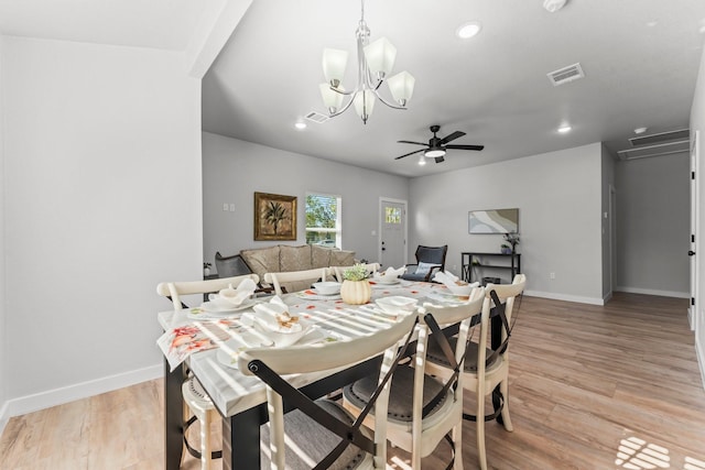 dining space with ceiling fan and light wood-type flooring